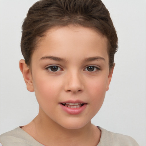 Joyful white child female with short  brown hair and brown eyes