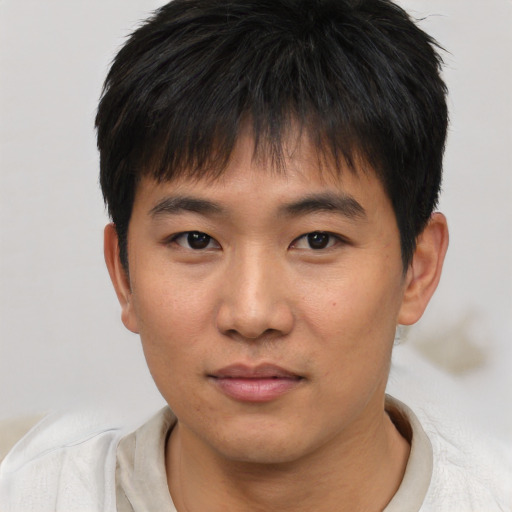 Neutral asian young-adult male with short  brown hair and brown eyes