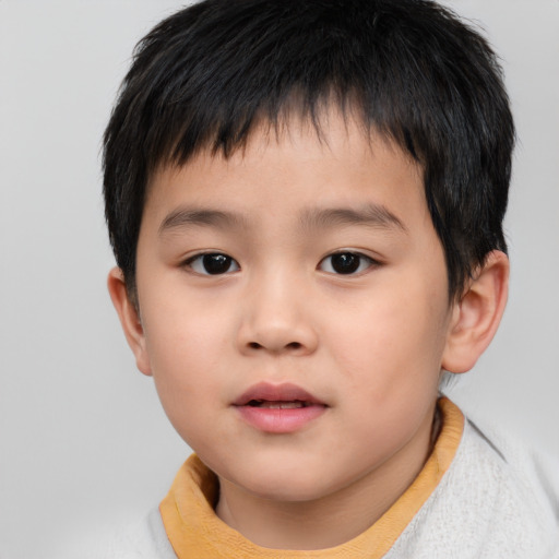 Neutral asian child male with short  brown hair and brown eyes