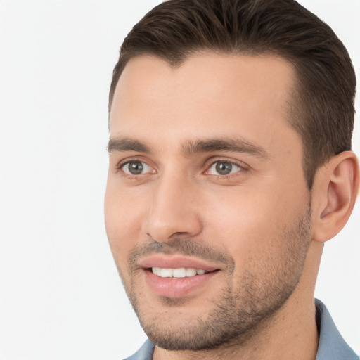 Joyful white young-adult male with short  brown hair and brown eyes