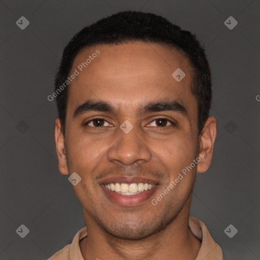 Joyful black young-adult male with short  black hair and brown eyes