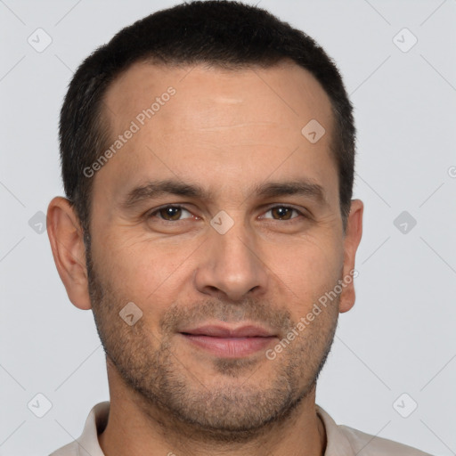 Joyful white adult male with short  brown hair and brown eyes