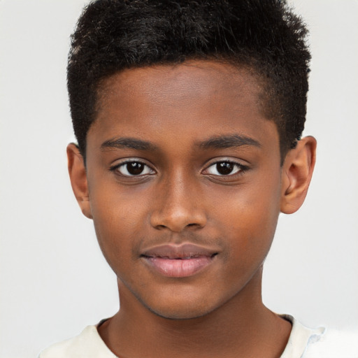 Joyful black child male with short  brown hair and brown eyes