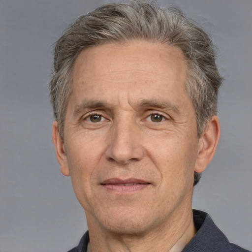 Neutral white middle-aged male with short  gray hair and brown eyes