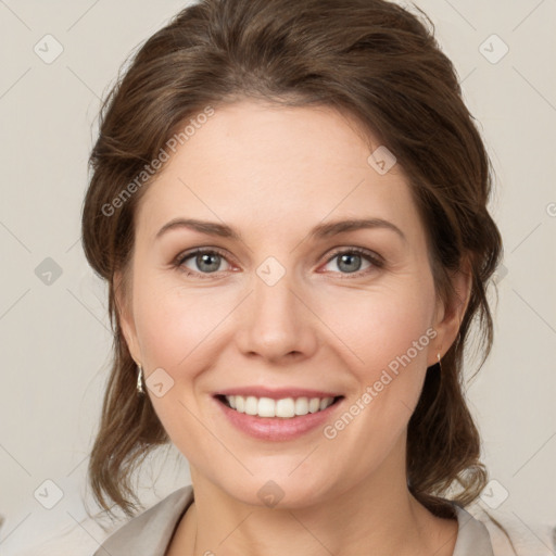 Joyful white young-adult female with medium  brown hair and green eyes