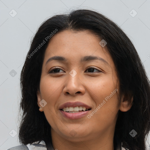 Joyful latino young-adult female with long  brown hair and brown eyes