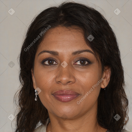 Joyful black adult female with medium  brown hair and brown eyes