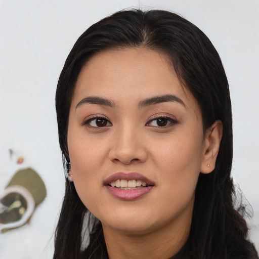 Joyful asian young-adult female with long  black hair and brown eyes