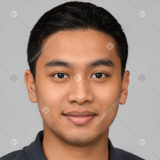 Joyful latino young-adult male with short  black hair and brown eyes