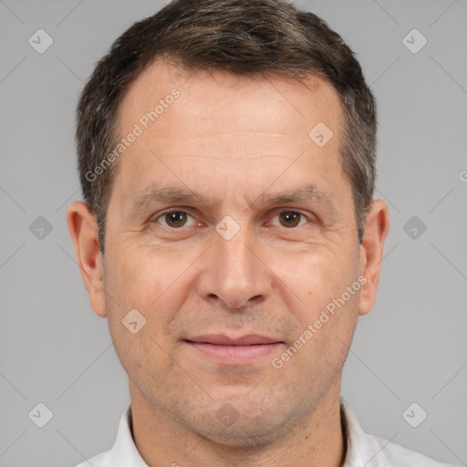 Joyful white adult male with short  brown hair and brown eyes