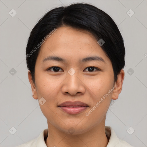 Joyful asian young-adult female with short  black hair and brown eyes