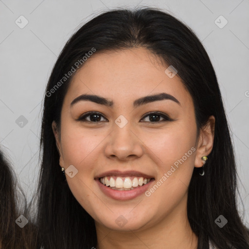 Joyful latino young-adult female with long  brown hair and brown eyes