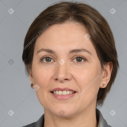 Joyful white adult female with medium  brown hair and brown eyes