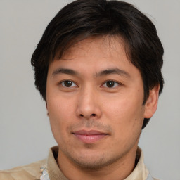 Neutral asian young-adult male with short  brown hair and brown eyes