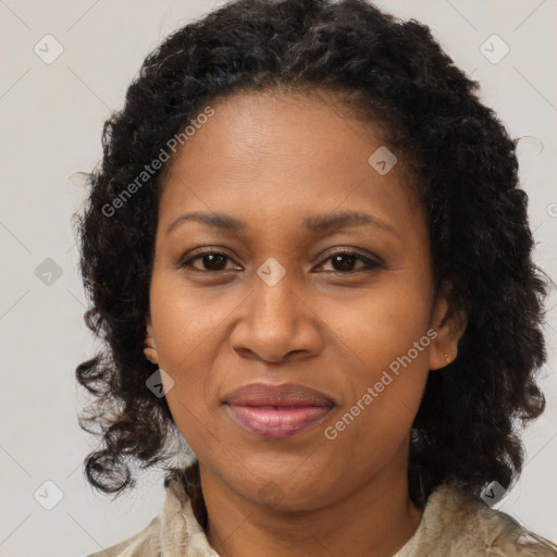 Joyful black adult female with medium  brown hair and brown eyes