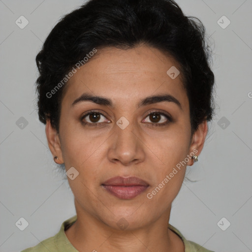 Joyful latino young-adult female with short  brown hair and brown eyes