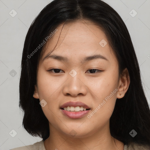 Joyful asian young-adult female with long  brown hair and brown eyes