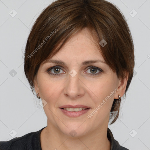 Joyful white adult female with medium  brown hair and brown eyes