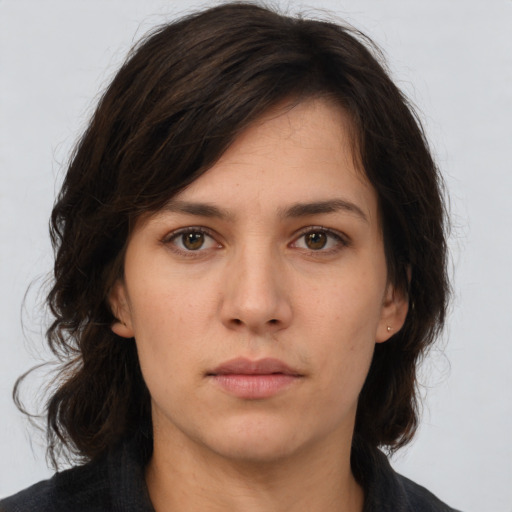 Neutral white young-adult female with medium  brown hair and brown eyes