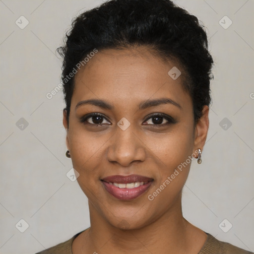 Joyful black young-adult female with short  black hair and brown eyes