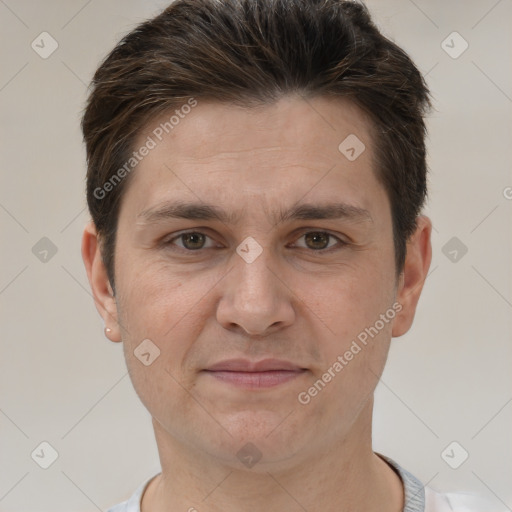 Joyful white adult male with short  brown hair and brown eyes