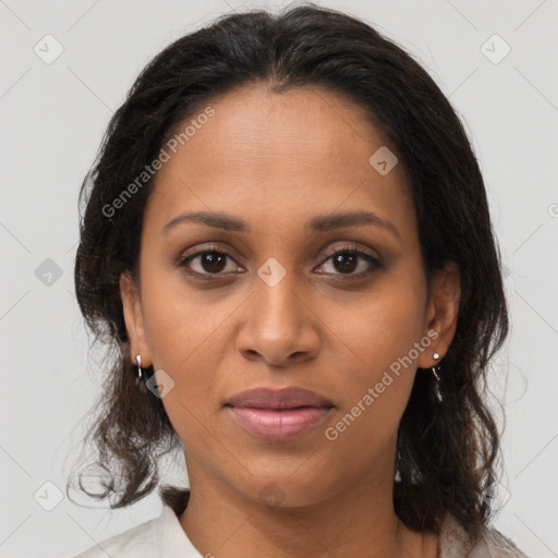 Joyful black adult female with medium  brown hair and brown eyes