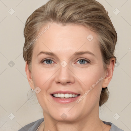 Joyful white adult female with short  brown hair and grey eyes