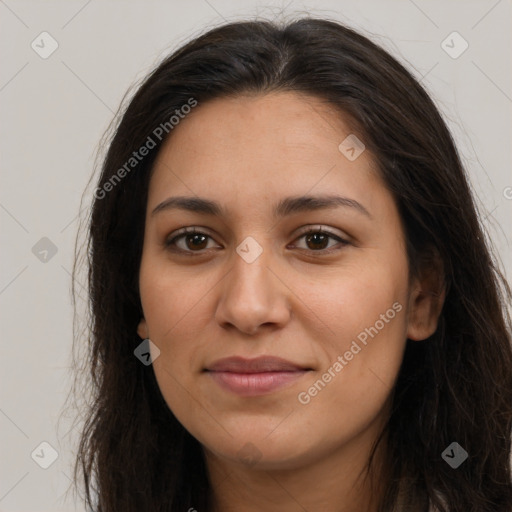 Joyful latino young-adult female with long  brown hair and brown eyes