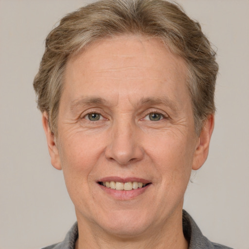 Joyful white middle-aged male with short  brown hair and grey eyes