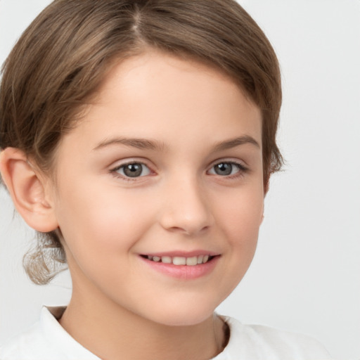 Joyful white child female with short  brown hair and brown eyes