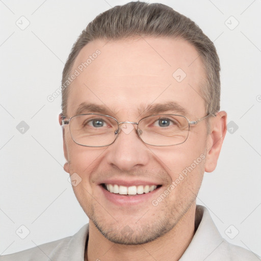 Joyful white adult male with short  brown hair and brown eyes