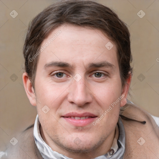 Joyful white adult male with short  brown hair and grey eyes