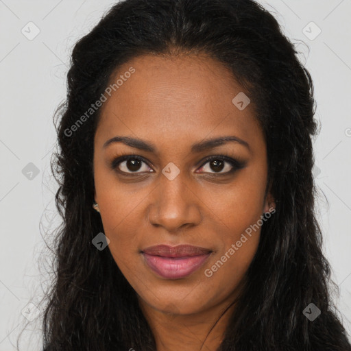 Joyful black young-adult female with long  brown hair and brown eyes