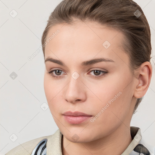 Neutral white young-adult female with short  brown hair and brown eyes