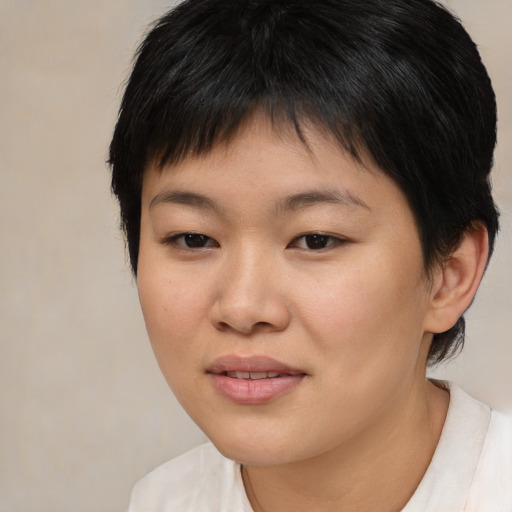 Joyful asian young-adult female with short  brown hair and brown eyes