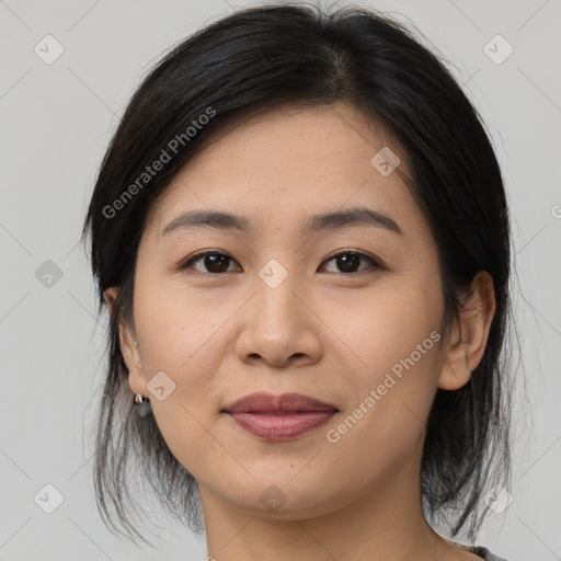 Joyful asian young-adult female with medium  brown hair and brown eyes