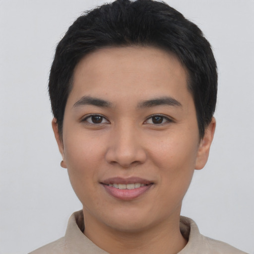 Joyful asian young-adult female with short  black hair and brown eyes