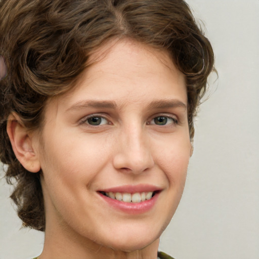 Joyful white young-adult female with medium  brown hair and green eyes