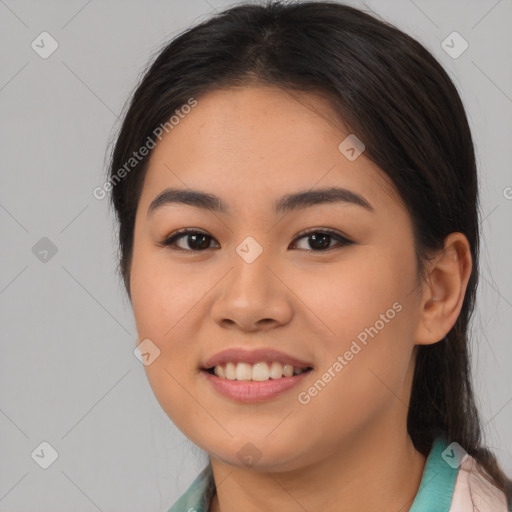 Joyful asian young-adult female with long  brown hair and brown eyes