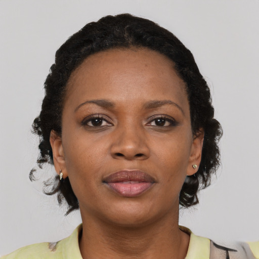 Neutral black young-adult female with short  brown hair and brown eyes