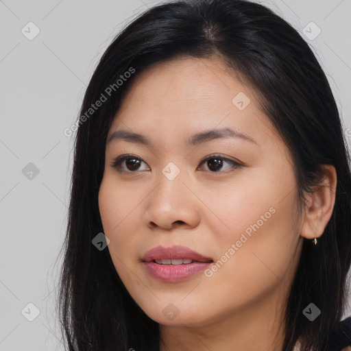 Joyful asian young-adult female with long  brown hair and brown eyes