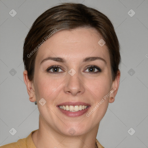 Joyful white young-adult female with short  brown hair and grey eyes