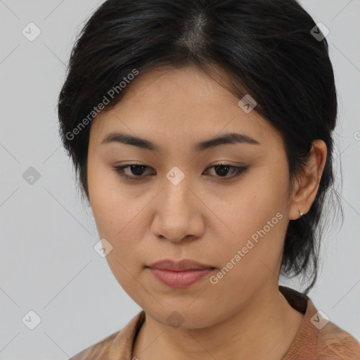 Joyful asian young-adult female with medium  brown hair and brown eyes