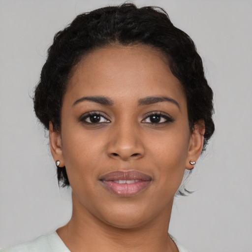 Joyful latino young-adult female with short  brown hair and brown eyes