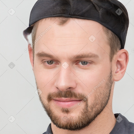 Neutral white young-adult male with short  brown hair and grey eyes