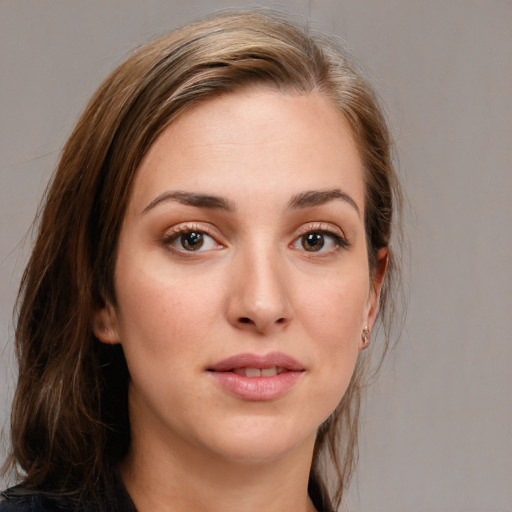 Joyful white young-adult female with medium  brown hair and grey eyes