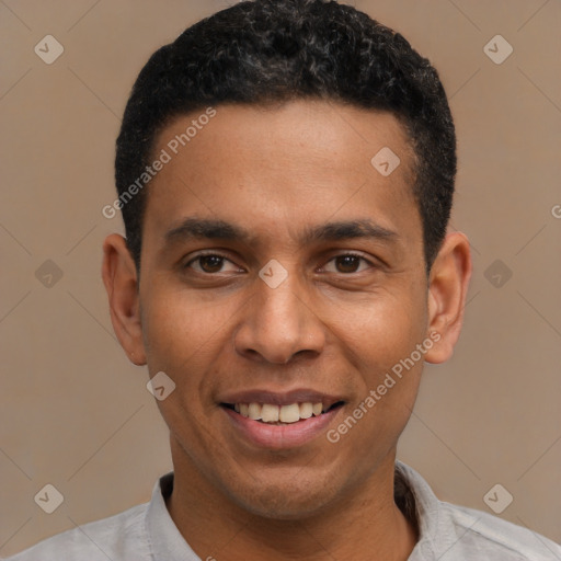 Joyful latino young-adult male with short  black hair and brown eyes