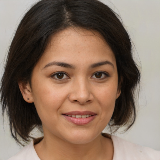 Joyful white young-adult female with medium  brown hair and brown eyes