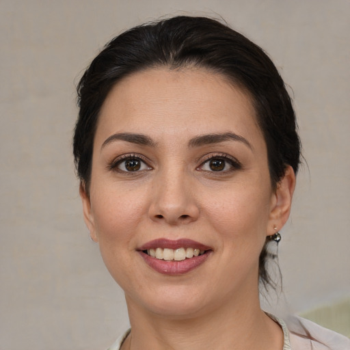 Joyful white young-adult female with medium  brown hair and brown eyes