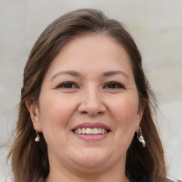 Joyful white adult female with medium  brown hair and brown eyes